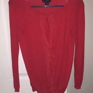 Red button up sweater